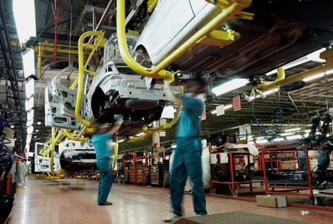 car assembly two men in a plant car assembly two men