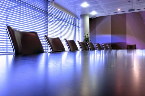 C-suite Table with chairs around it