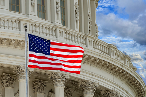 U.S. Capitol with flag (Credit: Getty/Andrea Izzotti) U.S. Capitol with flag