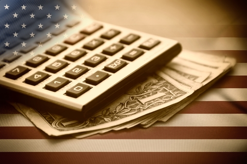 Federal budget spending (CREDIT: Getty/MrLonelyWalker) Calculator on American flag