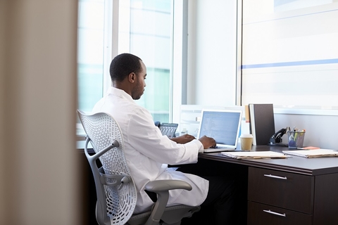 Doctor physician working healthcare desk laptop health IT CREDIT: Getty/monkeybusinessimages A doctor sitting at his desk working on a laptop computer.
