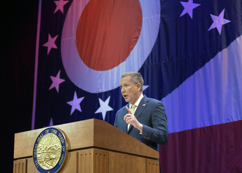 John Kasich John Kasich speaking at lectern