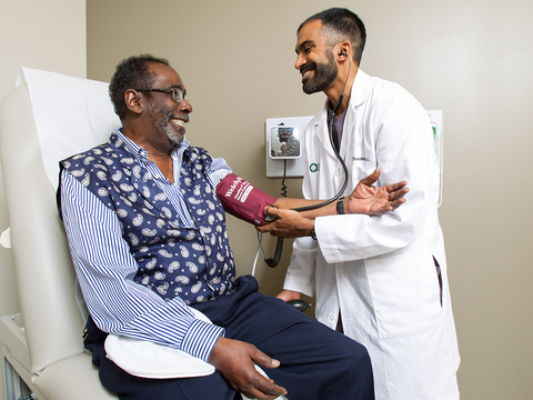 Oak Street Health patient and doctor (Credit: Oak Street Health) Oak Street Health patient and doctor