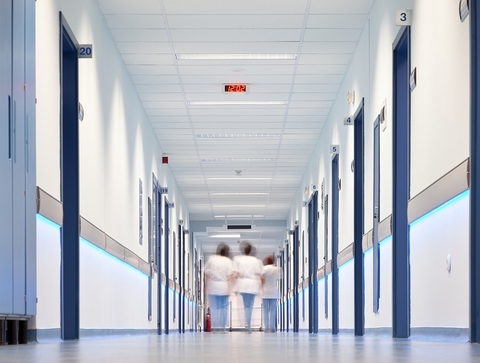 Healthcare hospital corridor nurse abstract (Getty/VILevi) Three nurses walking down a hospital corridor