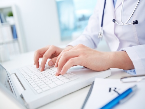 Doctor and laptop (credit: Getty/shironosov) Doctor typing on laptop