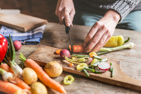 woman cutting vegetables woman cutting vegetables