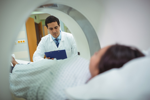 Doctor with patient CT scan