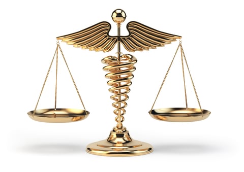 Medicine and law Medical caduceus symbol (staff of Hermes) holding up legal scales