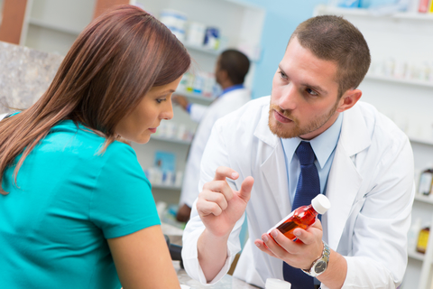 Pharmacist pharmacy patient medication adherence drug prescription CREDIT: Getty/Steve Debenport A pharmacist consulting with a patient holding medication