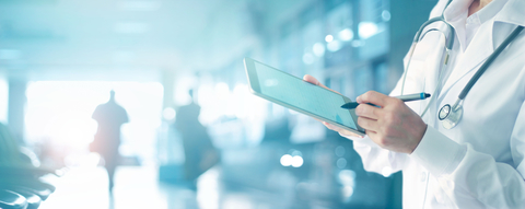 health IT doctor with tablet