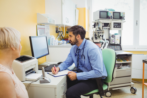 doctor writing prescription printer