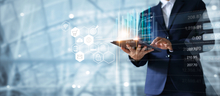 chief data officer executive using tablet with images of data and analytics