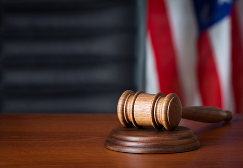 Gavel and flag in courtroom (Credit: Getty/AlexStar) Gavel and flag in courtroom