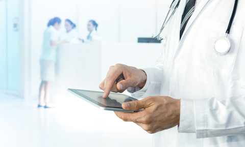 healthcare analytics doctor using tablet