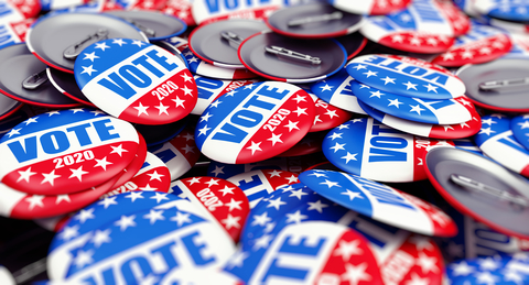 2020 Election badges A pile of buttons that read "Vote 2020"