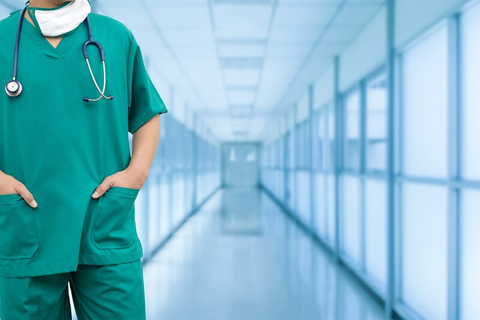Practice Management doctor physician nurse scrubs hospital (Getty/NanoStockk) A physician in scrubs in a hospital hallway