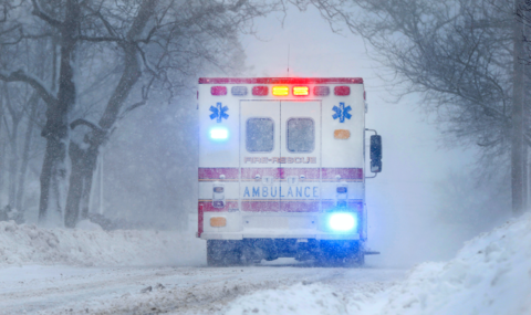 Ambulance An ambulance drives through winter weather