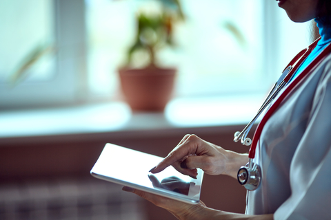 Doctor holding a tablet A doctor holding a table
