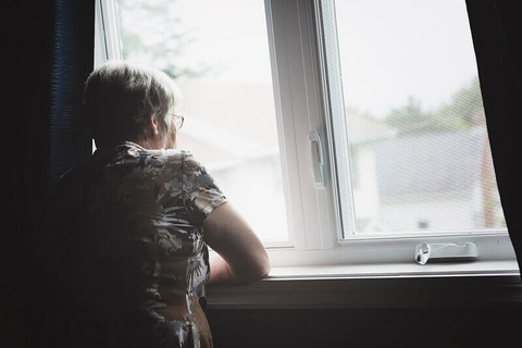 Isolated senior citizen Isolated senior citizen looking out window