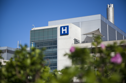 Hospital A photo of the exterior of a hospital on a sunny day