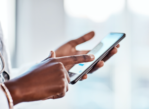 Telemedicine A doctor is holding a phone