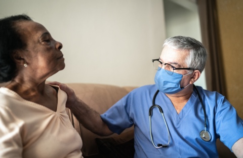 Nursing home A health provider meets with a senior woman