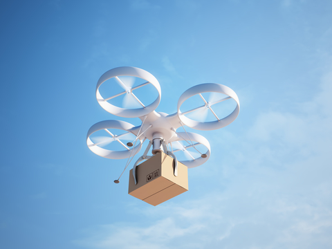 Drone delivery A drone mid-flight delivering a package