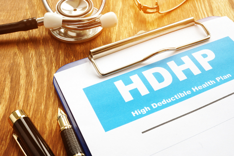 High-deductible health plan A clipboard that reads "high-deductible health plan"