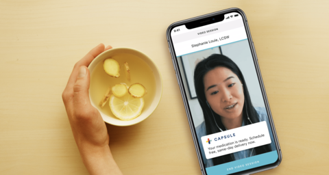 Ginger Capsule drug delivery partnership Smartphone screen with screenshot of Capsule digital health platform