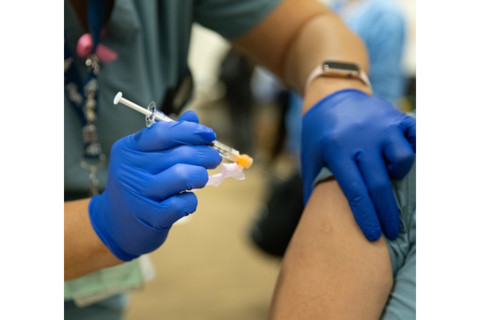 Vaccination A healthcare worker administers a vaccine