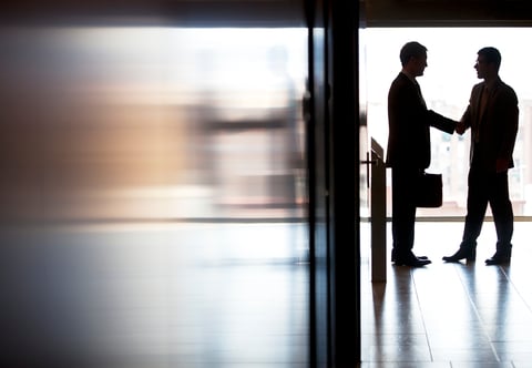 Business shaking hands deals M&A CREDIT: Getty/Sam Edwards Two businessmen shaking hands in a hallway
