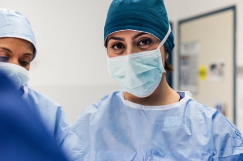 Female doctor A surgeon looks directly at the camera