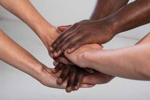 Hands joined together to promote racial equality