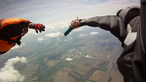 passing baton skydiving changing hands