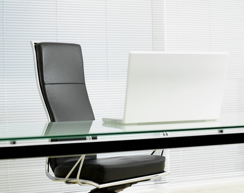 C-suite desk chair Empty desk chair in modern office