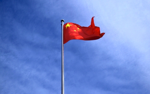 China flag against blue sky