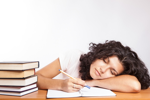 Image of girl asleep on books Image of girl asleep on books