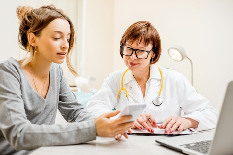Woman iPhone doctor Woman iPhone doctor