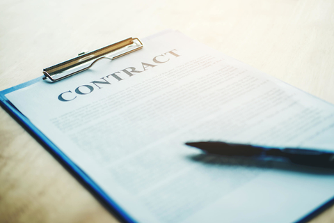 Business contract on a clipboard Pen on a business contract