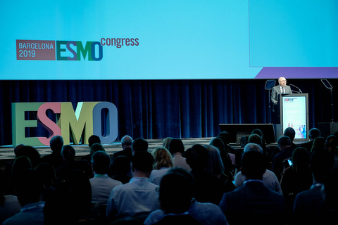 ESMO 2019 cancer drug conference stage Person speaking onstage at ESMO 2019 in Barcelona