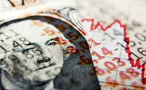 Red stock market graph and dollar bill Red stock market line indicating recession and superimposed dollar bill