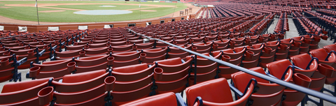 Baseball stadium with rows of red seats Baseball stadium with rows of red seats