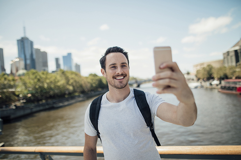 young man millennial taking selfie 