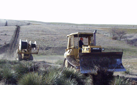Plowing fiber optic cable in Northwest Kansas (Image: Rural Telephone via USDA Flickr stream) Plowing fiber optic cable in Northwest Kansas (Image: Rural Telephone via USDA Flickr stream)