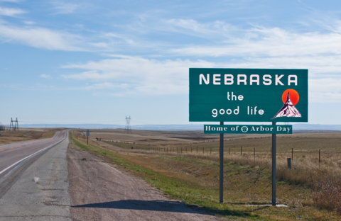 Nebraska A picture of the Nebraska state sign by the side of a rural road