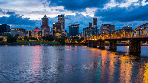 Portland, Oregon // Photo by CrackerClips/iStock/Getty Images Plus/Getty Images View of the Portland, Oregon skyline across the river at night time