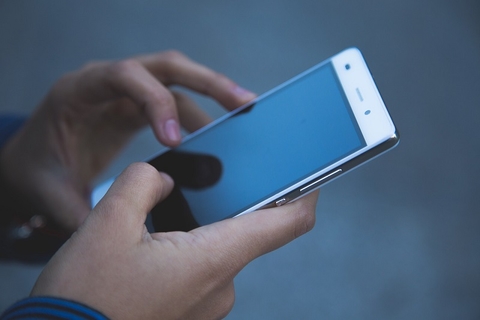 Smartphone hands holding smartphone
