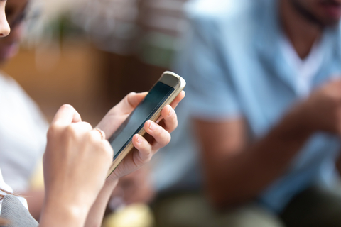 woman holding smartphone woman holding smartphone