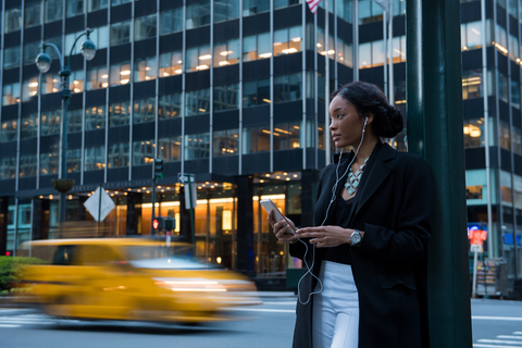 Woman on smartphone in city Woman on smartphone in city