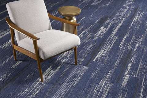 Textured Sky The solution-dyed carpet tiles are made with a type 6 nylon fiber—manufactured by Bristol, Va.–based Universal Fibers—which tops a PVC-free, open-cell, cushion backing.